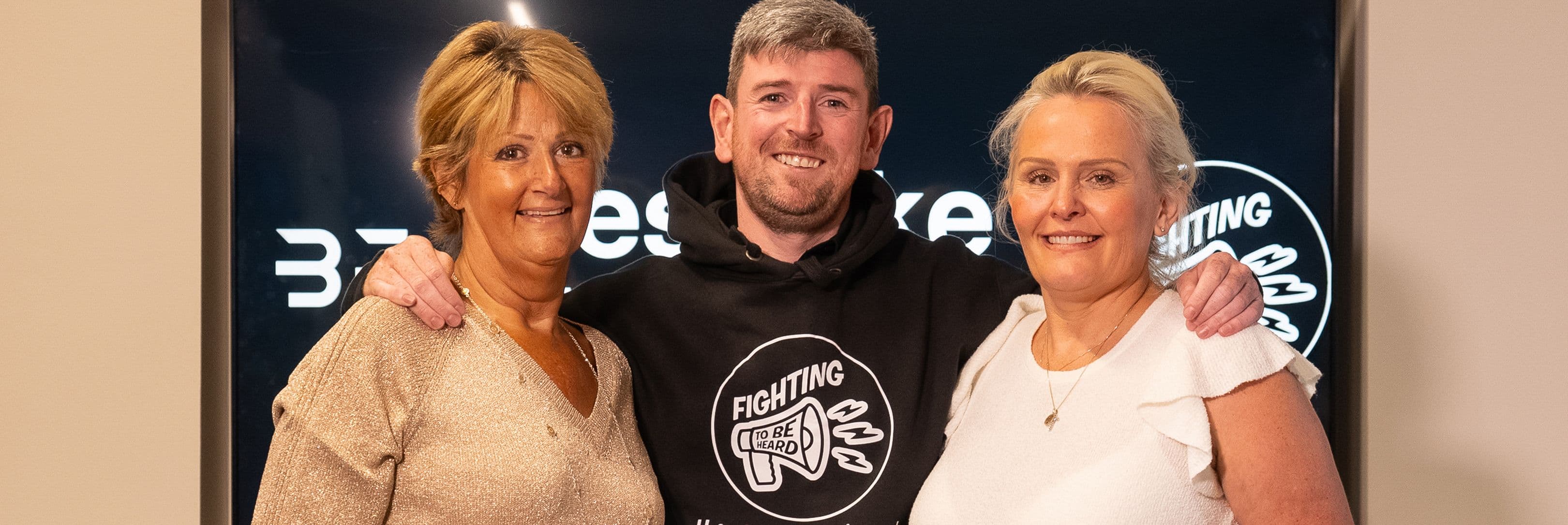 Bespoke fireplace giving a cheque to charity